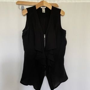 Black zip up blouse with ruffles. Size XS. By cache.